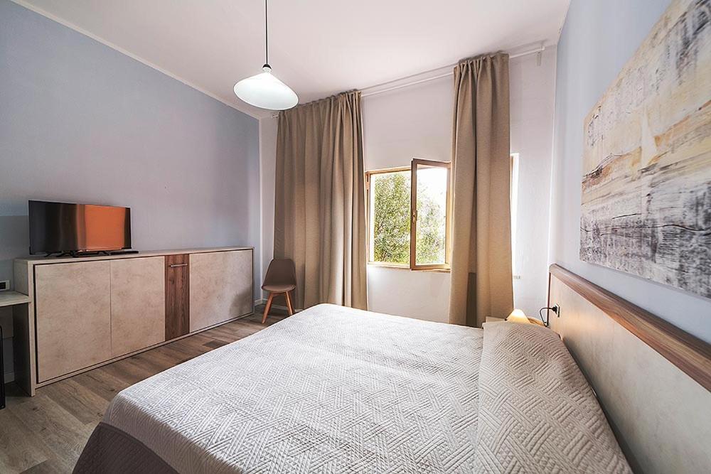 Hotel Belmare Porto Azzurro Bagian luar foto